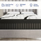A bed with a white tufted mattress featuring black marble-look veining, set against a gray upholstered headboard and footboard. Two dark side tables with vases sit on either side.