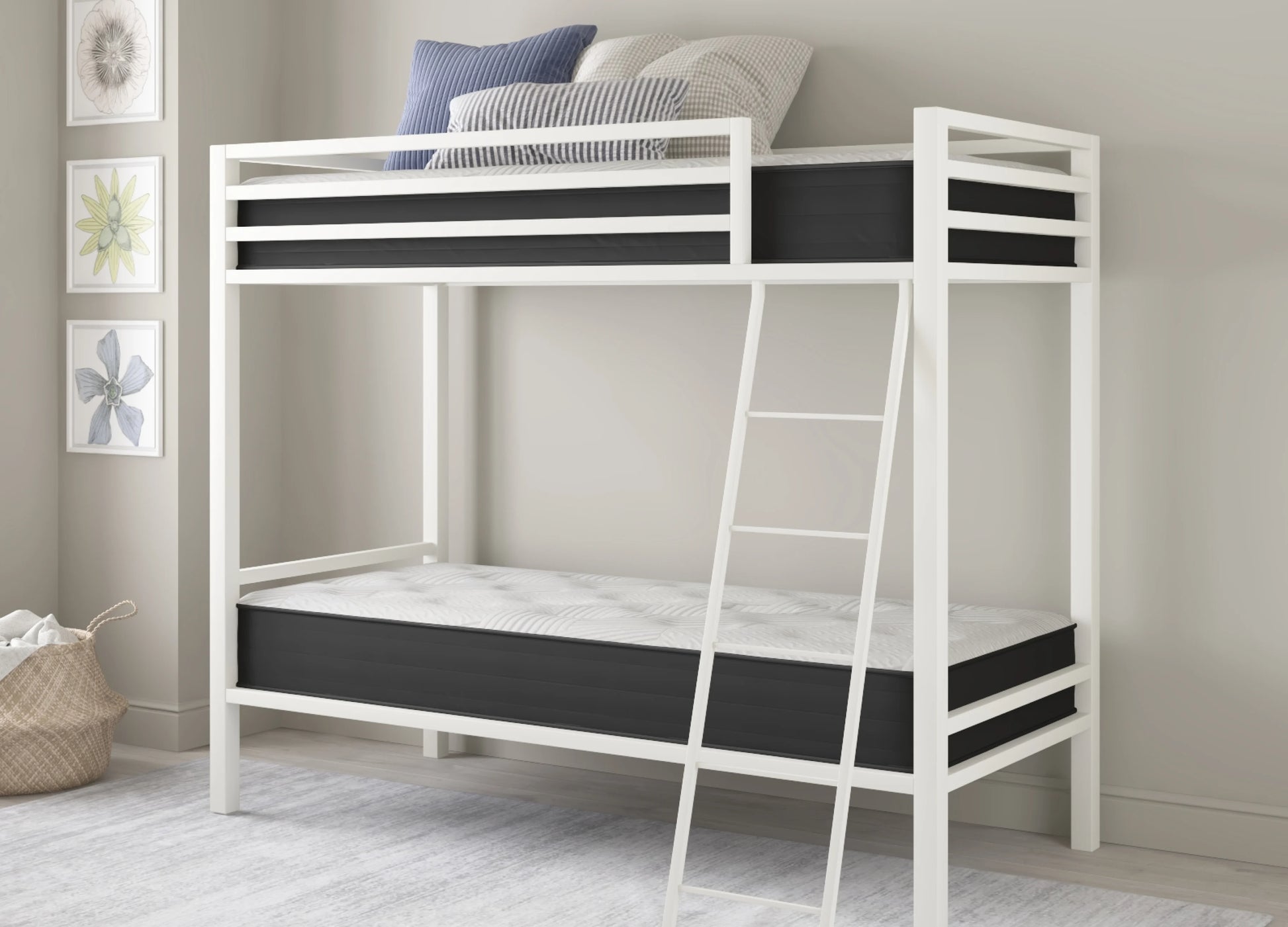 White metal bunk bed frame with black mattress panels and a ladder, shown in a styled bedroom setting with pillows and wall art.