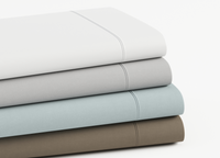 Folded flat sheets showing all colors - Mattress King