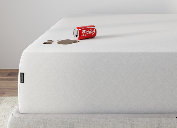 Mattress protector on a bed with spilled coke - Mattress King