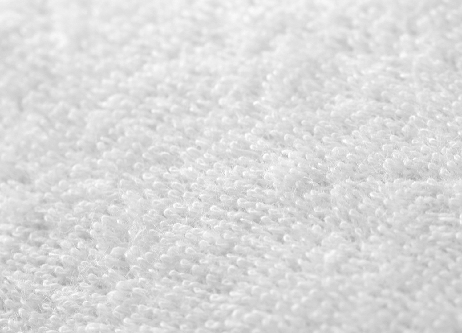 Terry cloth texture detail embossed into the waterproof membrane on the Mattress Protector - Mattress King