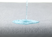Video of a person spilling a liquid on the Mattress Protector to show it is waterproof - Mattress King